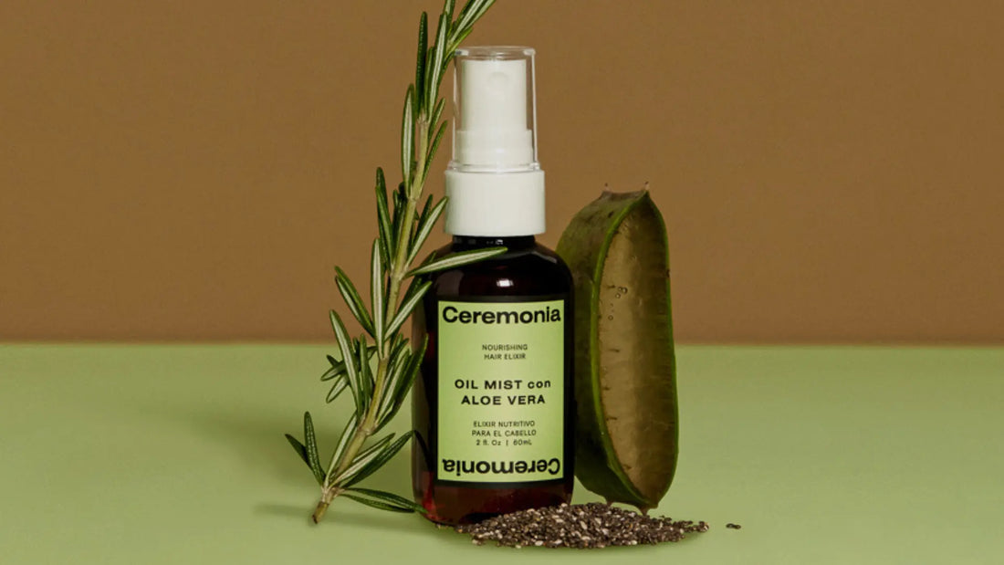 Aloe vera for hair shown in Ceremonia Oil Mist bottle with fresh aloe leaf, rosemary sprig, and chia seeds.