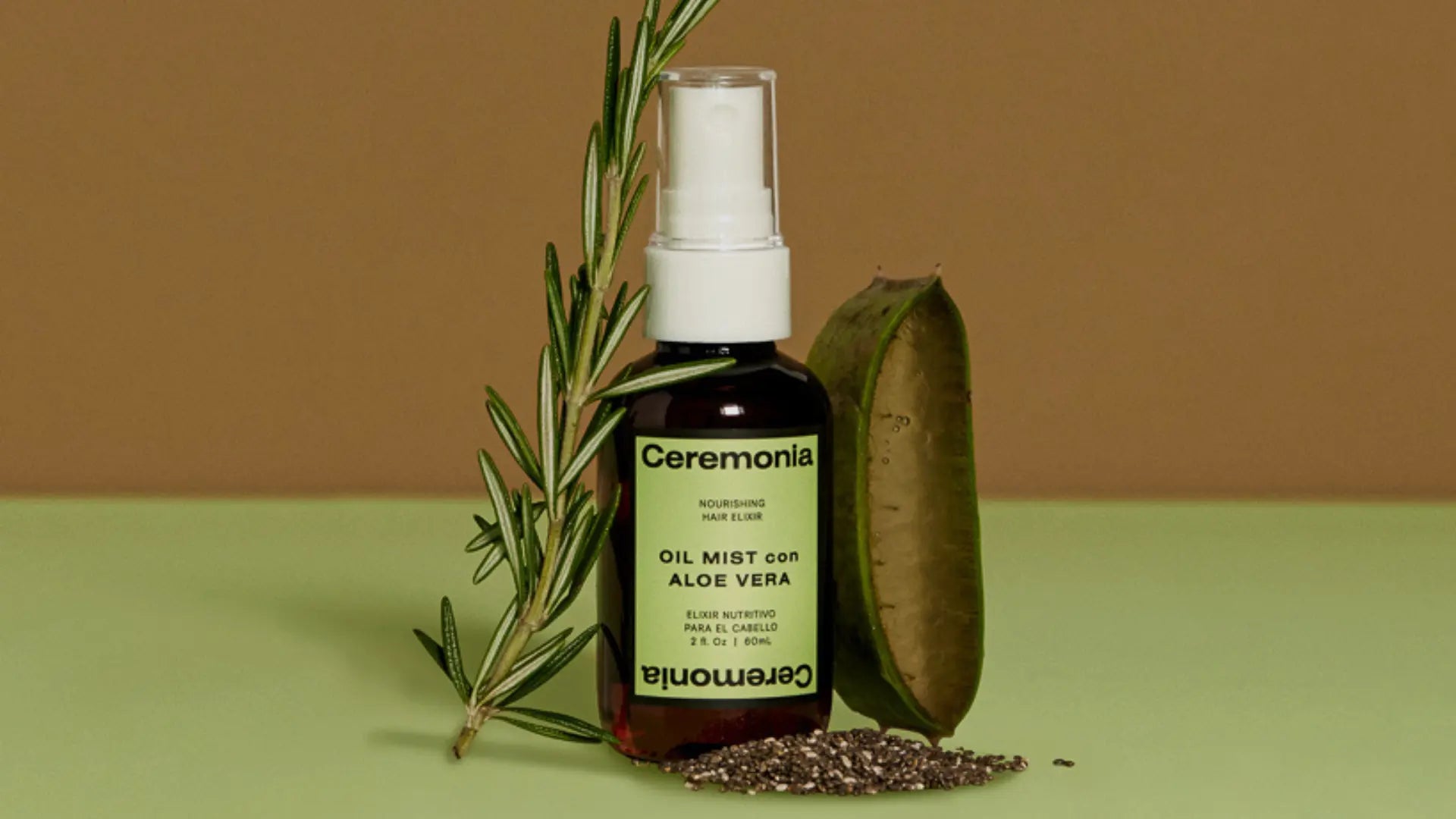 Aloe vera for hair shown in Ceremonia Oil Mist bottle with fresh aloe leaf, rosemary sprig, and chia seeds.