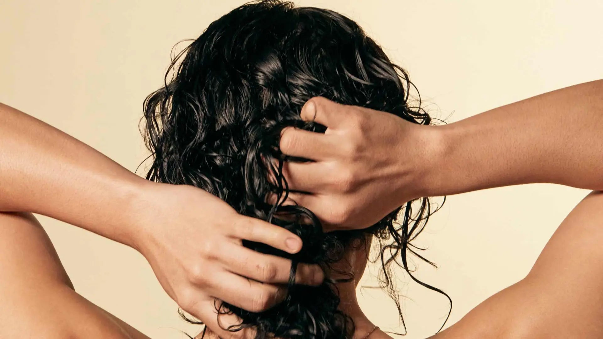 Frizzy hair products applied to damp curls to reduce frizz and enhance definition.