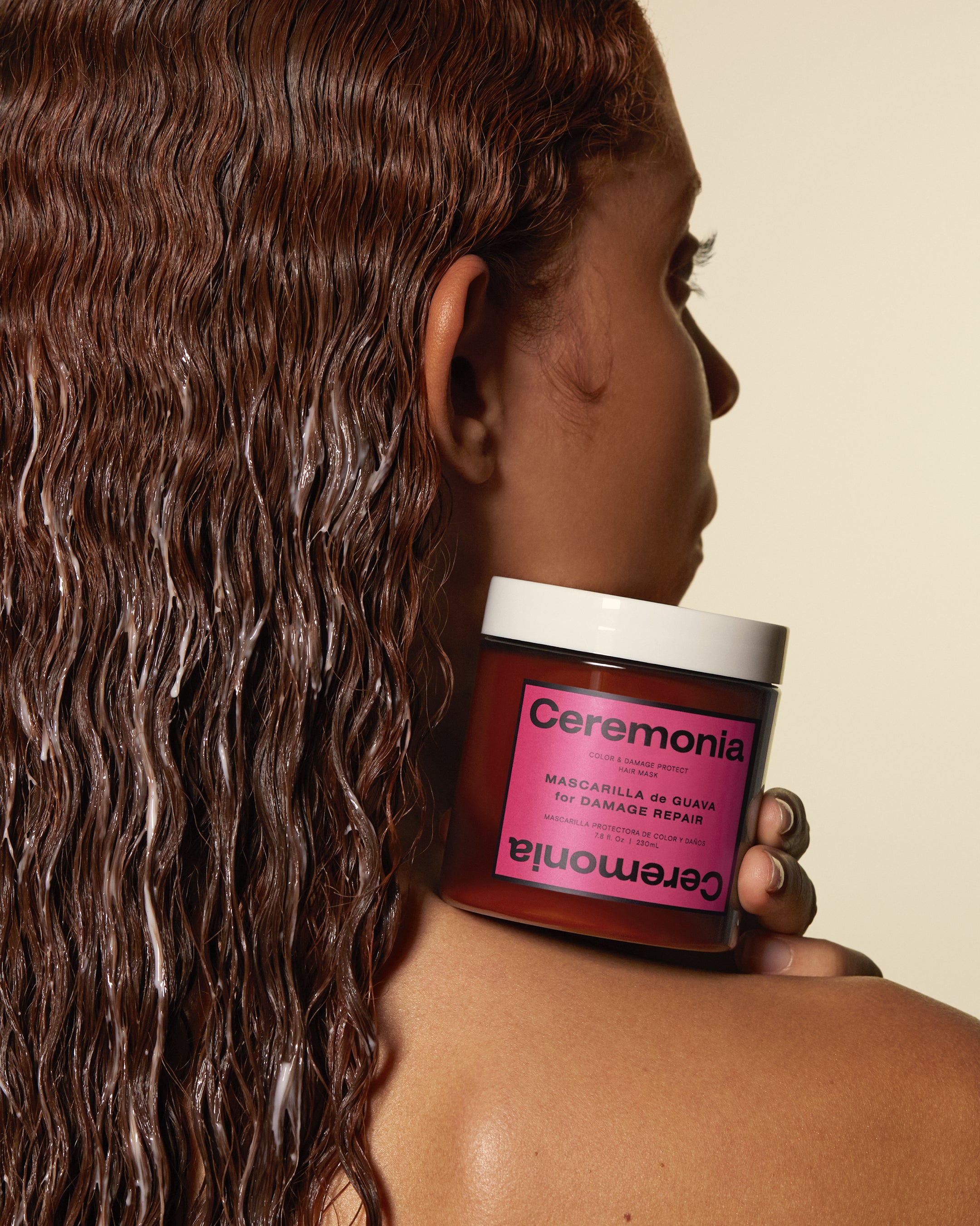 Hair mask for colored hair applied to wet strands, shown with Ceremonia Mascarilla de Guava for damage repair.