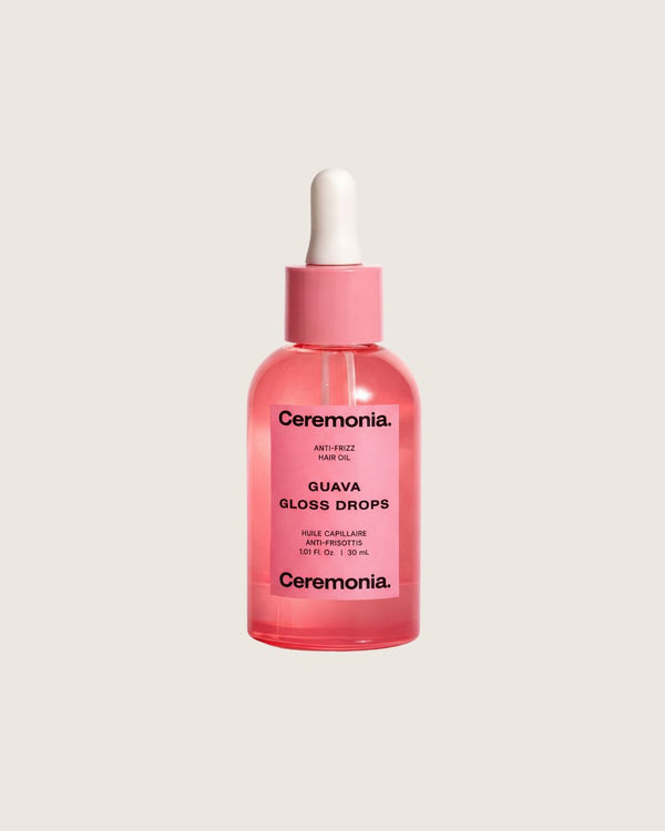 Ceremonia Guava Gloss Drops anti-frizz hair oil in a pink glass dropper bottle, 30 mL.