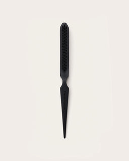 Black slick back styling brush with vegan bristles and a tapered pointed handle engraved with Ceremonia.