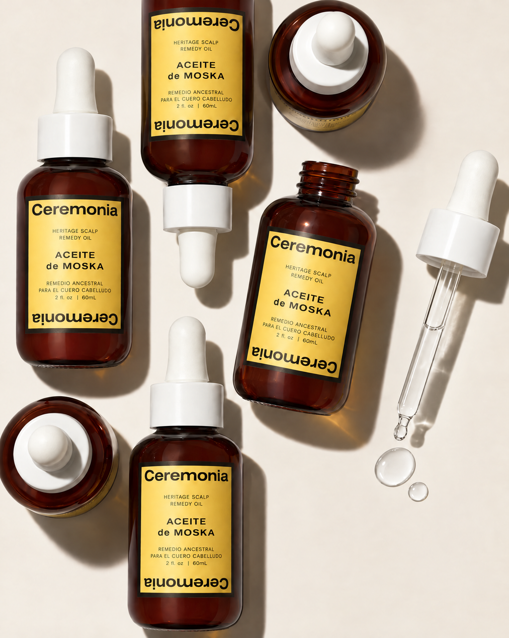 Various bottles and droppers next to each other in flatlay format.