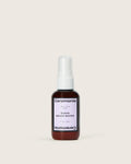 Mini 2 fl oz amber bottle of Guava Beach Waves salt texture spray with lavender label.