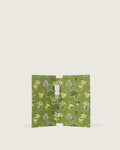 Perfume sample in a floral green cardholder with lemon and botanical print.