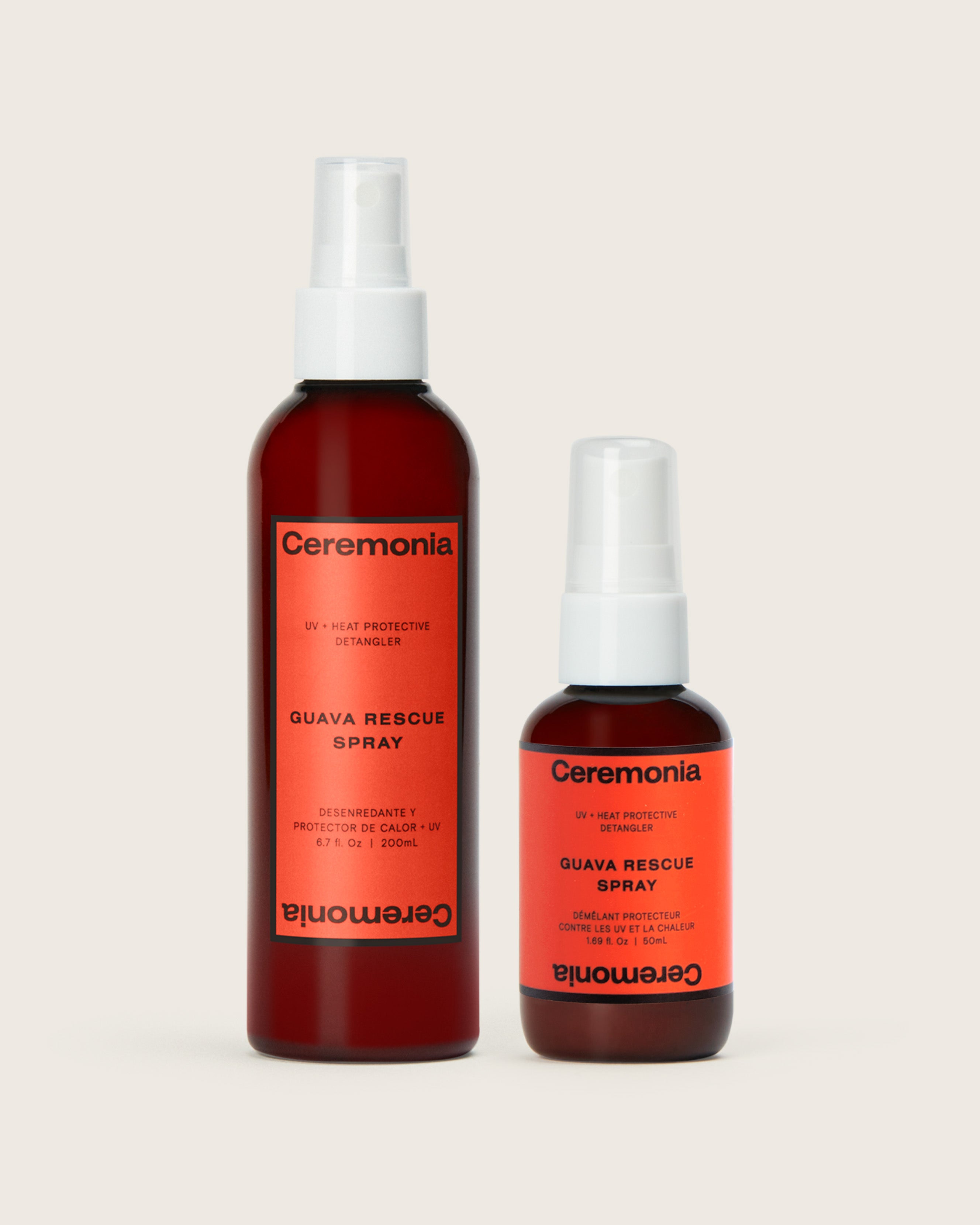 Guava hair detangler spray set with UV and heat protection in 200ml and 50ml bottles on a neutral background.