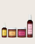 Hair care products by Ceremonia including scalp oil, papaya scrub, guava repair mask, and guava leave-in conditioner.
