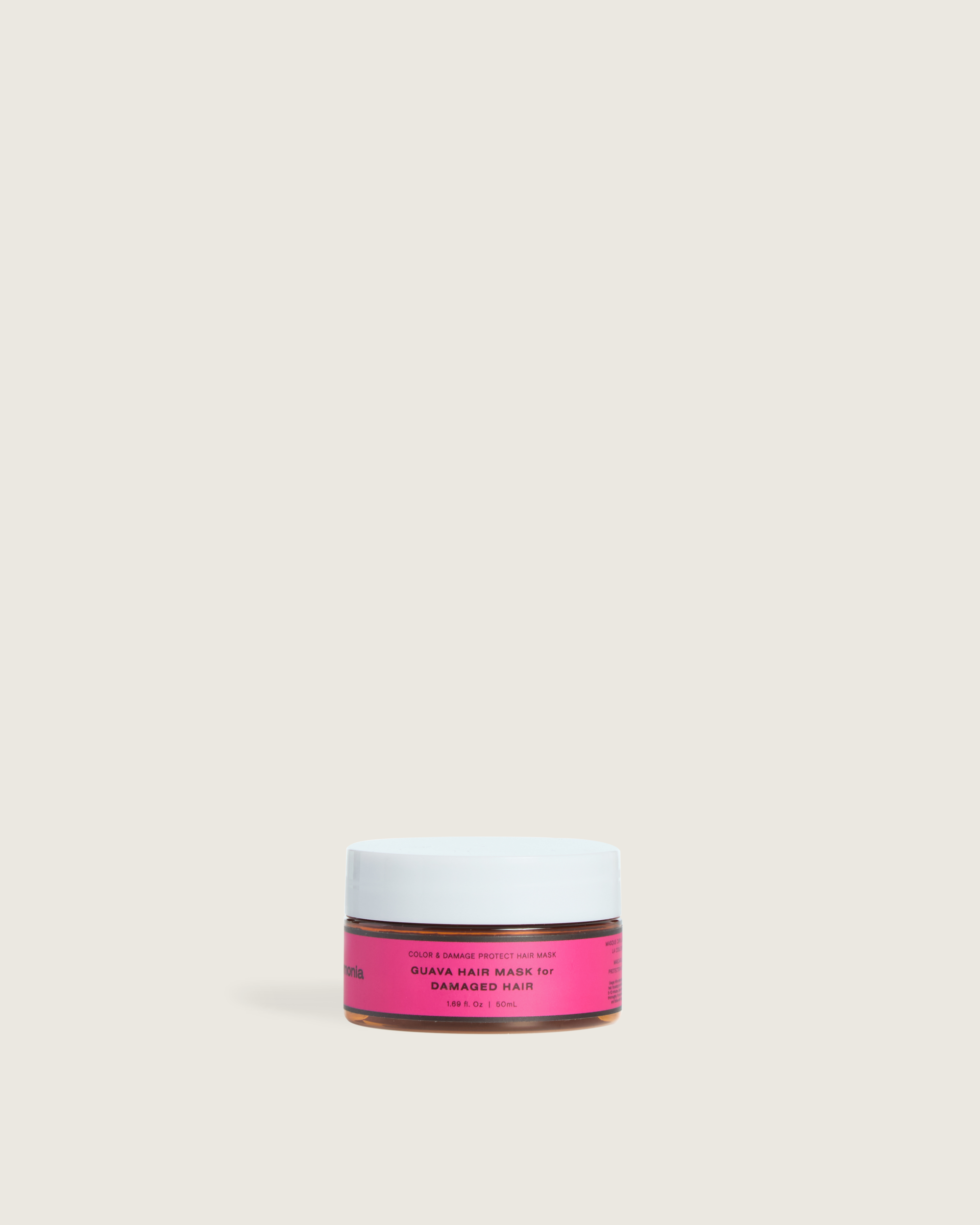 Guava hair mask in a travel-size Ceremonia jar, labeled "Guava Hair Mask for Damaged Hair," designed to protect color and repair damage.