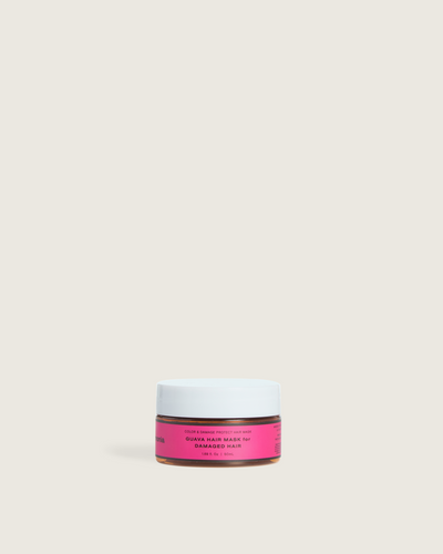 Guava hair mask in a travel-size Ceremonia jar, labeled "Guava Hair Mask for Damaged Hair," designed to protect color and repair damage.