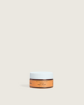 Papaya scalp scrub in a travel-size Ceremonia jar designed for exfoliating and cleansing the scalp.