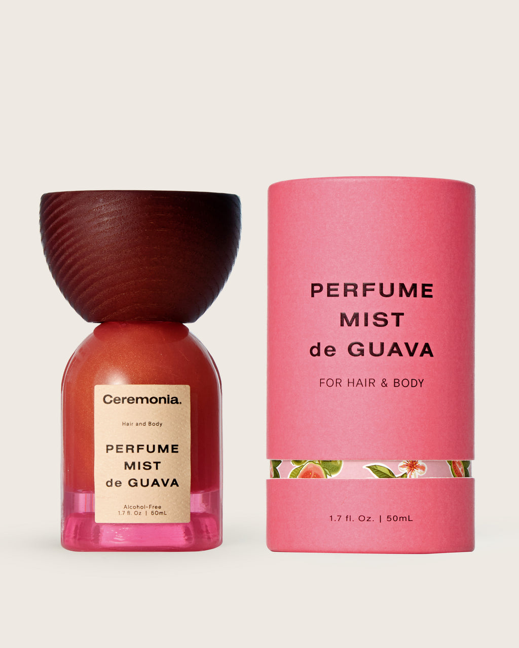 Guava perfume mist for hair and body in a 50mL bottle with pink floral packaging and wooden cap.