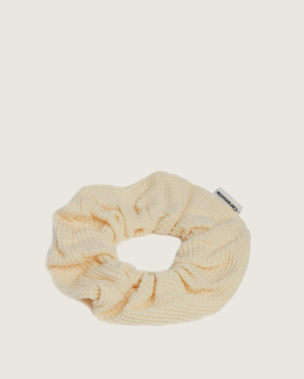 Cream waffle cotton Spa Scrunchie by Ceremonia with woven brand tag.