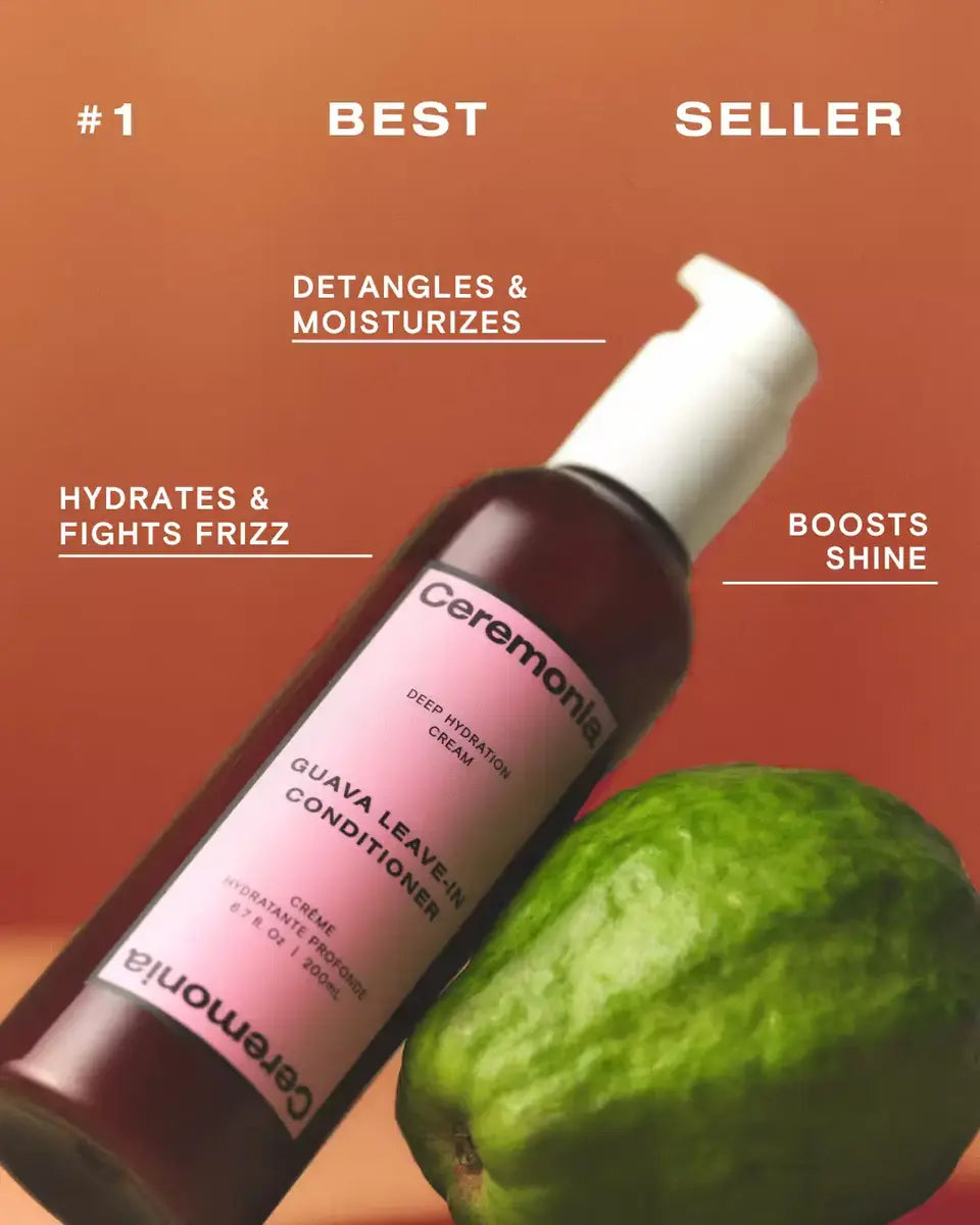 Ceremonia Guava Leave-In Conditioner beside a fresh guava, a bestseller that detangles and fights frizz.