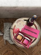 Ceremonia Sunday Reset Kit with Papaya Scalp Scrub and Guava Hair Mask on a tray.
