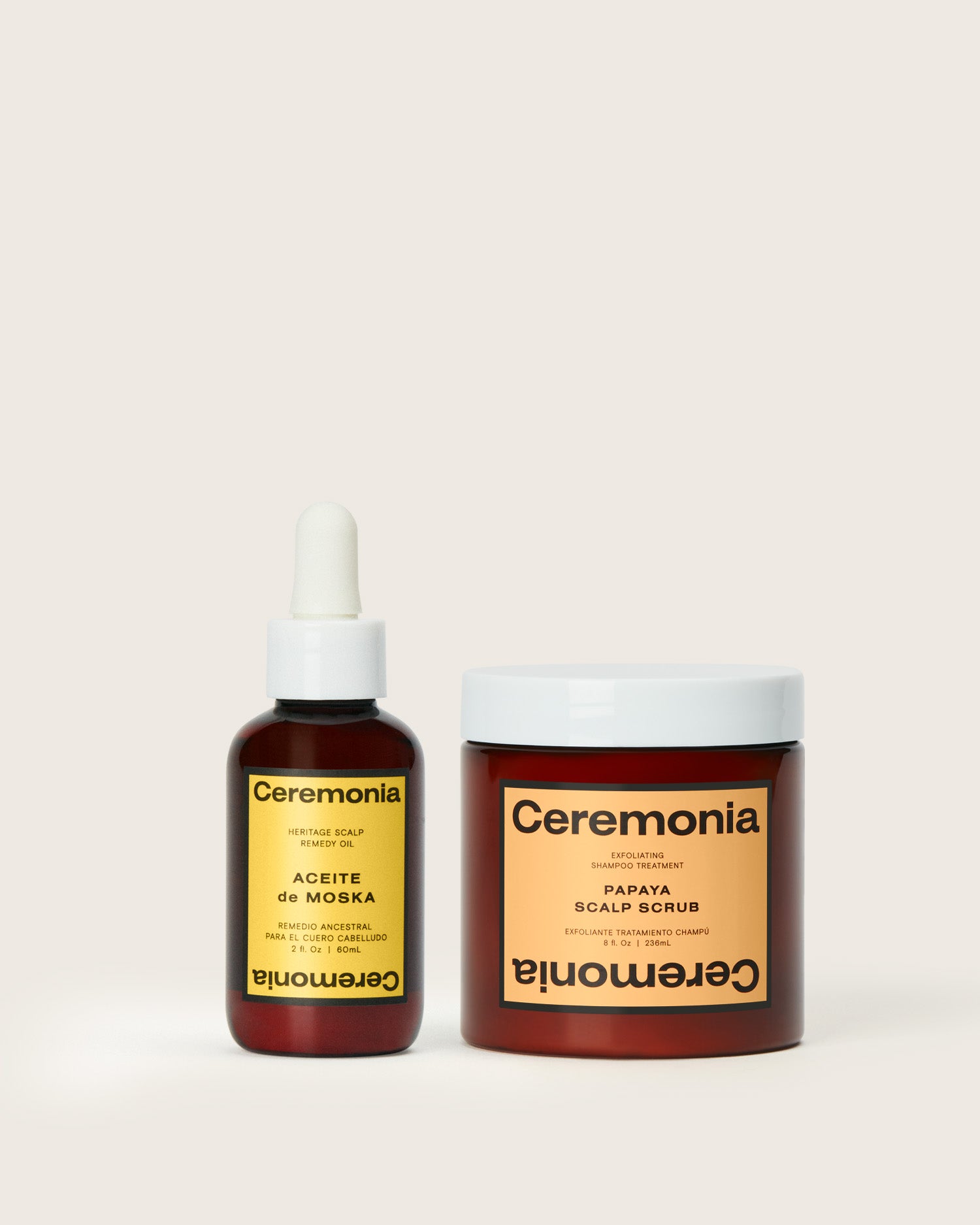 Scalp oil shown with Ceremonia Aceite de Moska bottle next to Papaya Scalp Scrub for a complete scalp care duo.