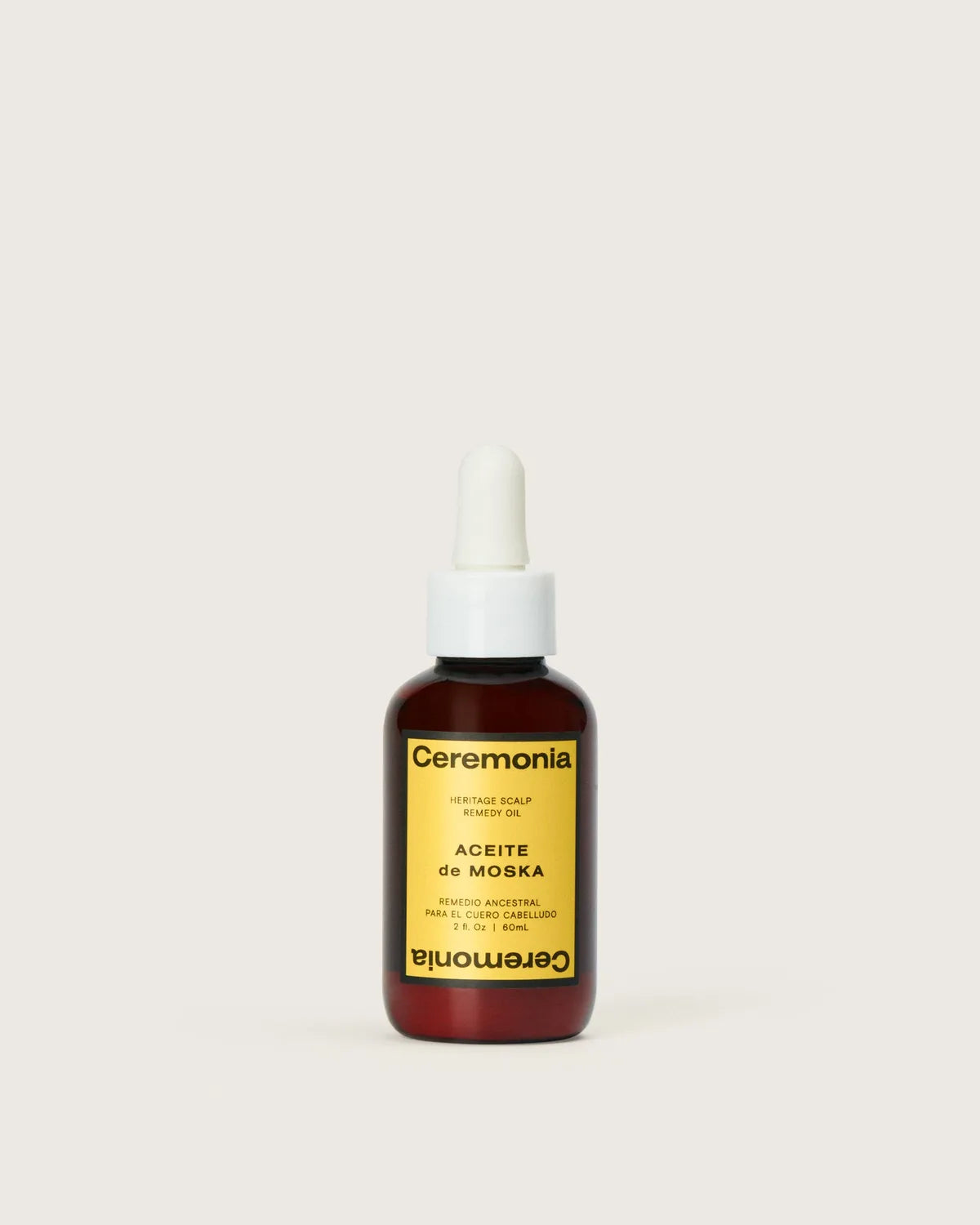 Ceremonia Aceite de Moska heritage scalp remedy oil in amber 60ml dropper bottle with yellow label.