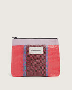 Coral pink upcycled Pouch de Mercado with woven black and blue stripes and lavender trim.