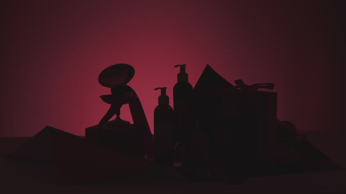 video showing dark stage slowly filling with light to reveal holiday kit. 