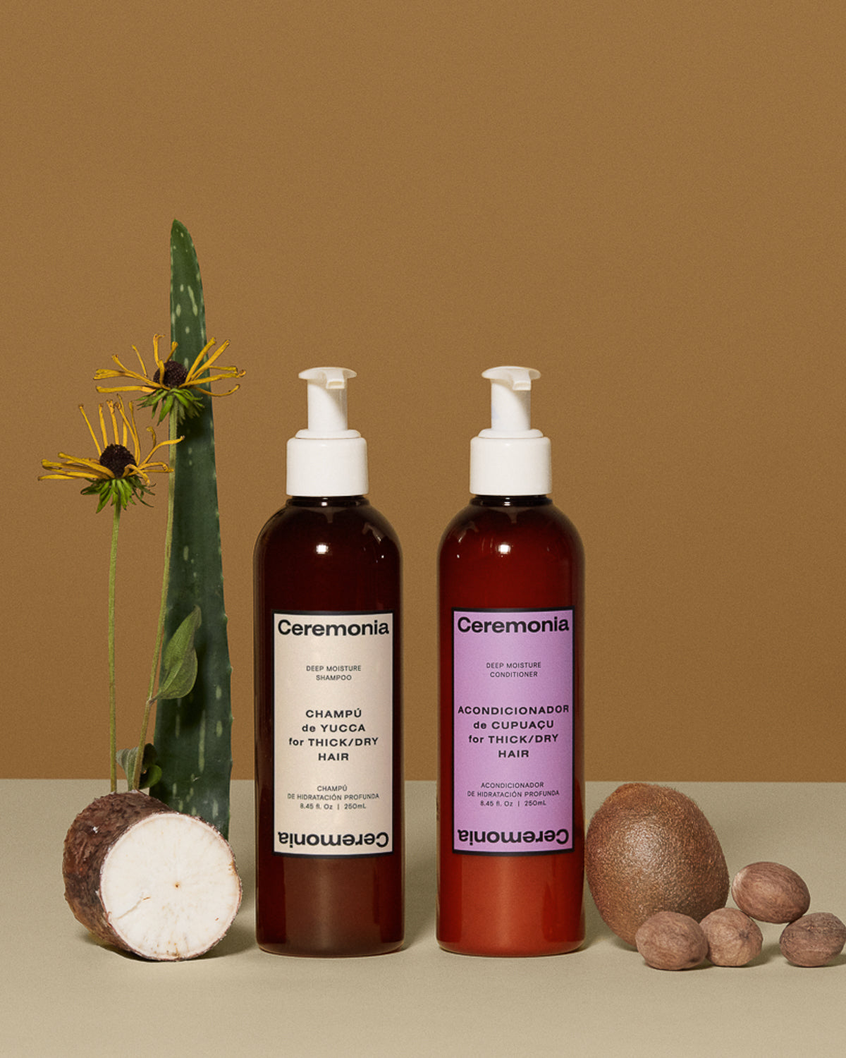 Ceremonia deep moisture shampoo and conditioner duo styled with aloe, yucca root, and cupuaçu pods.